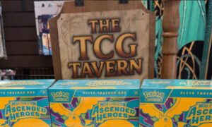 Promo photo of the TCG Tavern in Mission Viejo with Pokemon Ascended Heroes game boxes.