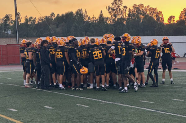 The Diablos meet at the 50-yard line before the game
